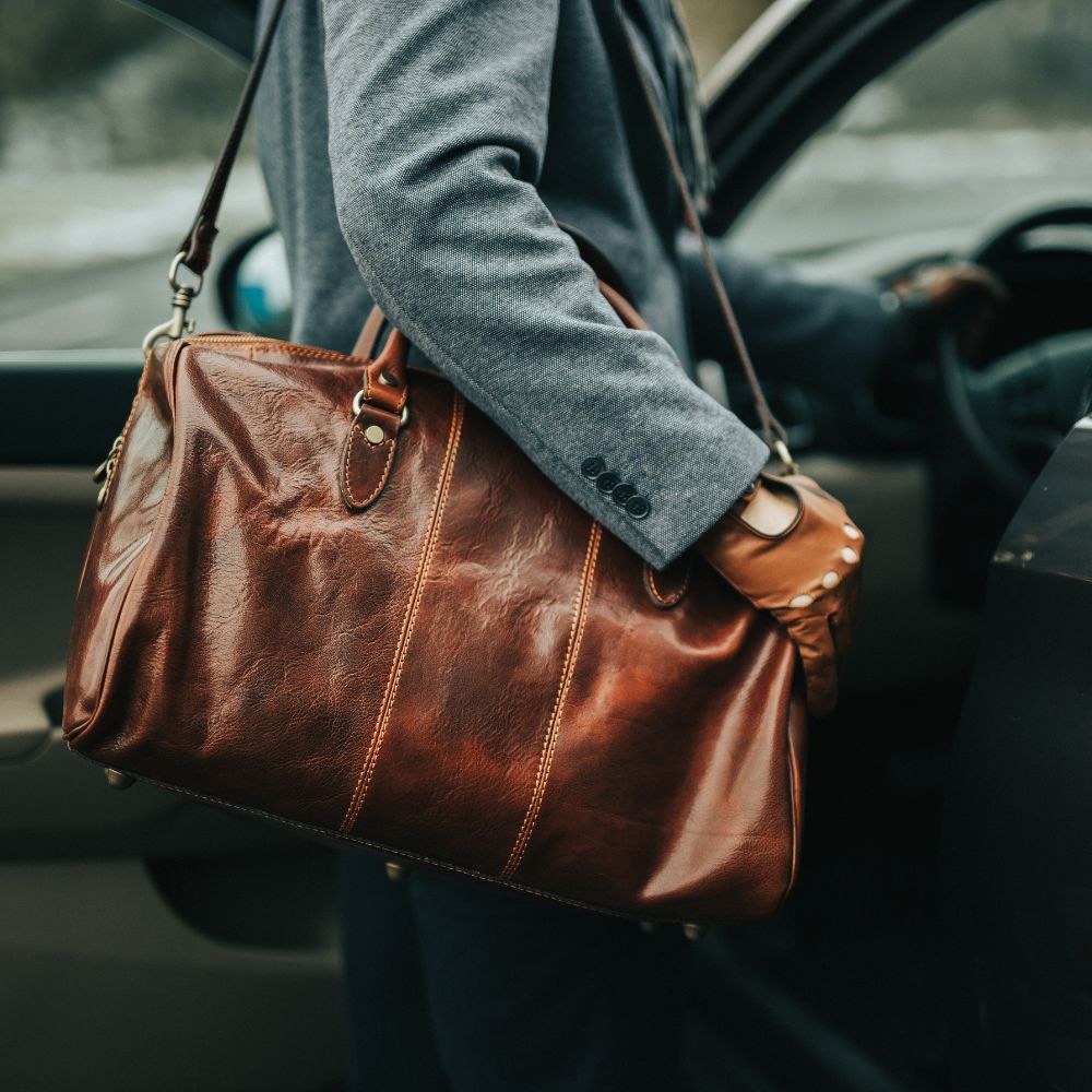 Man carrying a leather bag